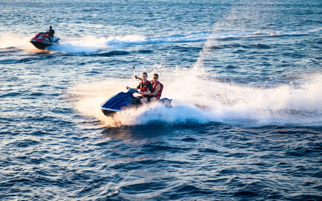 two men riding on jetski