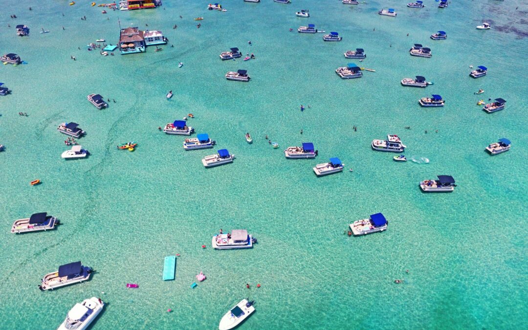 aerial view of boats on sea shore during daytime